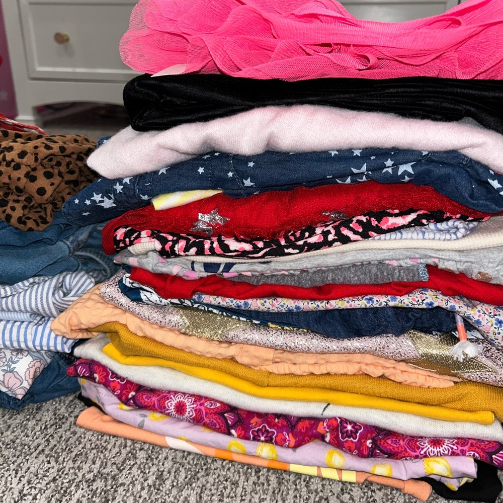 Bundle of 45+ pieces of girls clothing ranging in size from 12-24 moths.